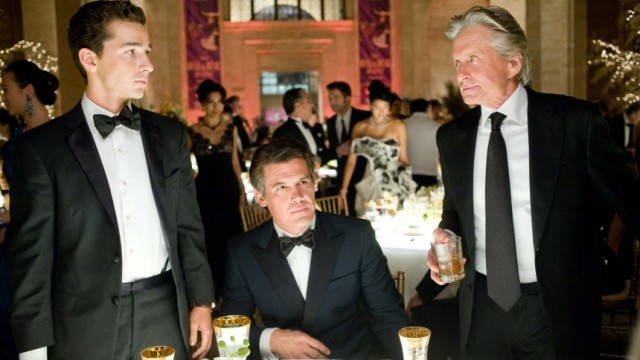 Actors LeBeouf, Brolin and Douglas are shown in a scene from Director Stone's film 'Wall Street 2: Money Never Sleeps' in this undated publicity photograph