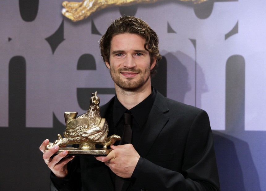 German football player Friedrich holds his 'Goldene Henne' award in category 'Sport' in Berlin