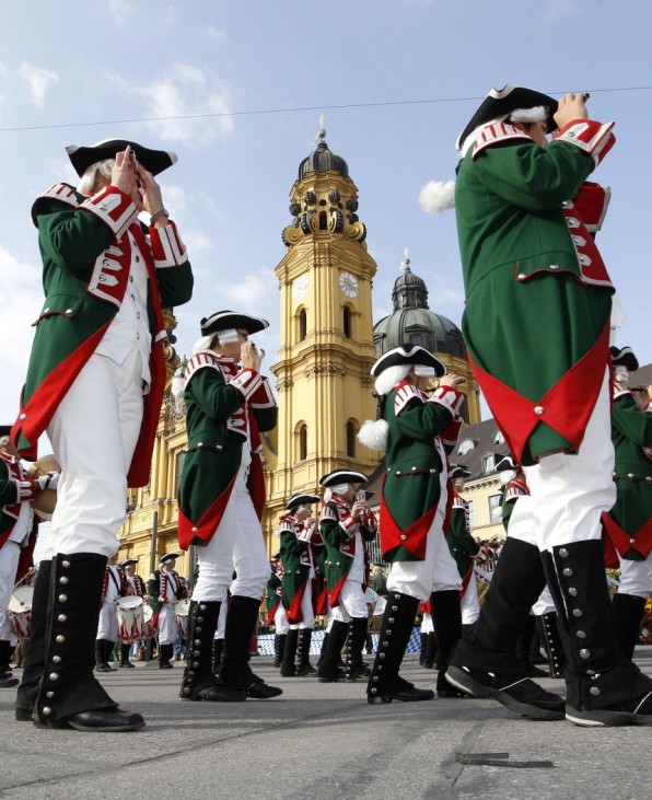 People in traditional costumes march during the Oktoberfest parade in Munich