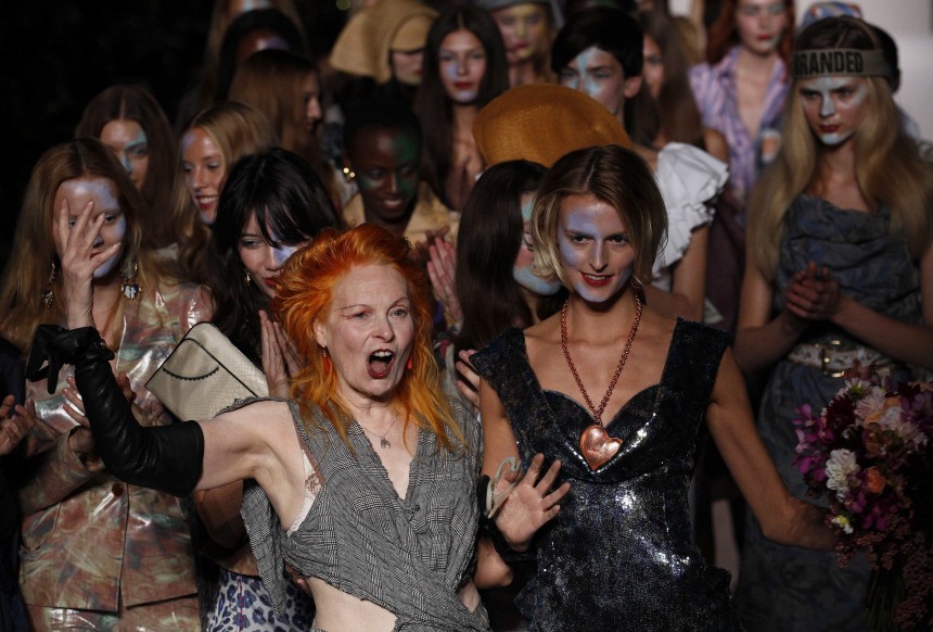 Fashion designer Westwood walks down the catwalk with her models following the presentation of her 2011 Spring/Summer collection at London Fashion Week