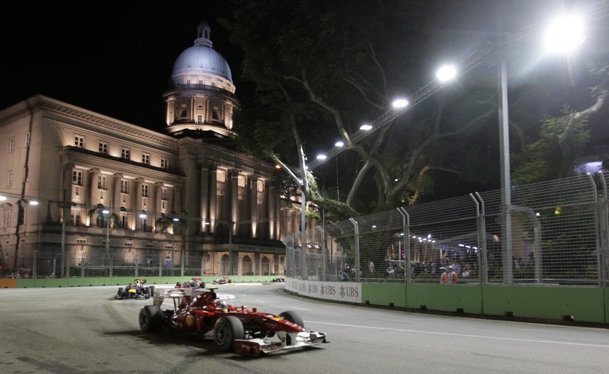 Ferrari Formula One driver Fernando Alonso of Spain powers around turn 10 in front of the Old Supreme Courthouse during the Singapore F1 Grand Prix at the Marina Bay circuit