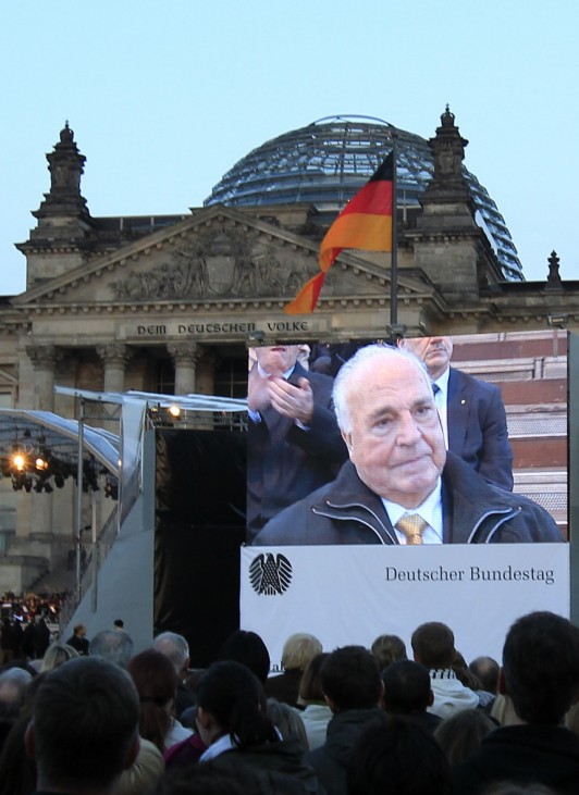 Former German Chancellor Helmut Kohl is seen on a huge screen at the German Bundestag during celebrations marking the country's 20th anniversary of reunification in Berlin