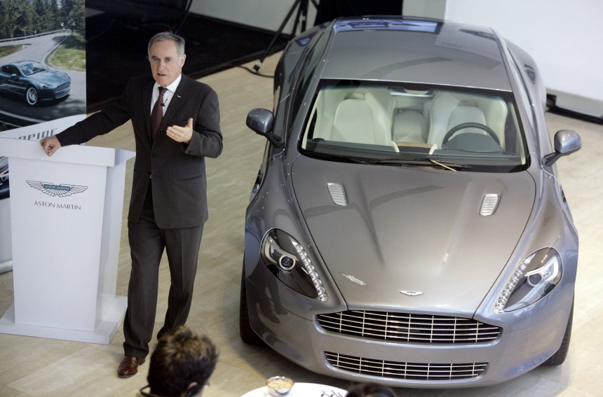 Aston Martin CEO Bez speaks next to the Aston Martin's first production four-door sports car Rapide in Beijing