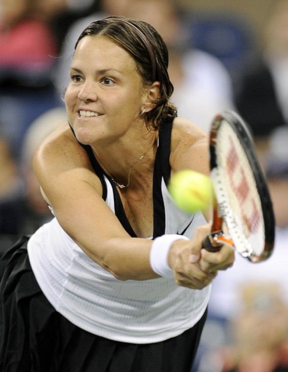Lindsay Davenport of the US hits a return to Alisa Kleybanova of Russia at the US Open tennis tournament at Flushing Meadows