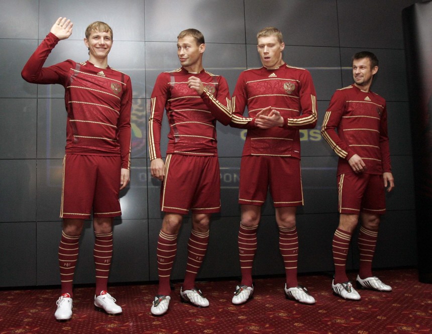 Pavlyuchenko, Berezutsky, Pogrebnyak and Semak, Russian national team soccer players, display the new national team kit during a presentation in Moscow