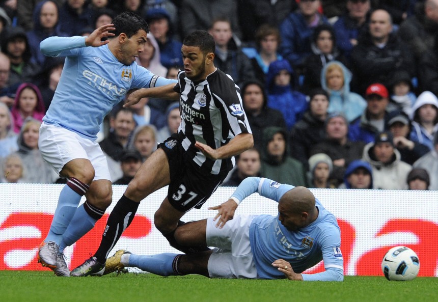 Manchester City's Jong and Tevez challenge Newcastle United's Ben Arfa during their English Premier League soccer match in Manchester
