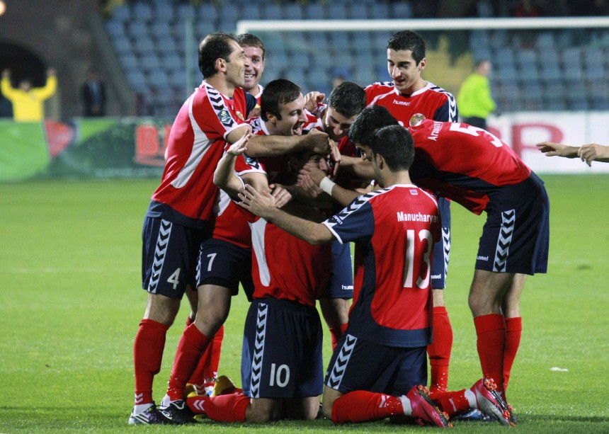 Armenia's players celebrate after scoring against Andorra during their Euro 2012 qualifying soccer match in Yerevan
