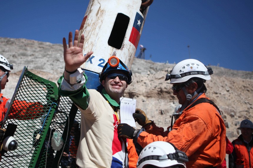 Miner Carlos Barrios Edison Pena becomes the 13th of the 33 trapped miners to reach the surface in Copiapo