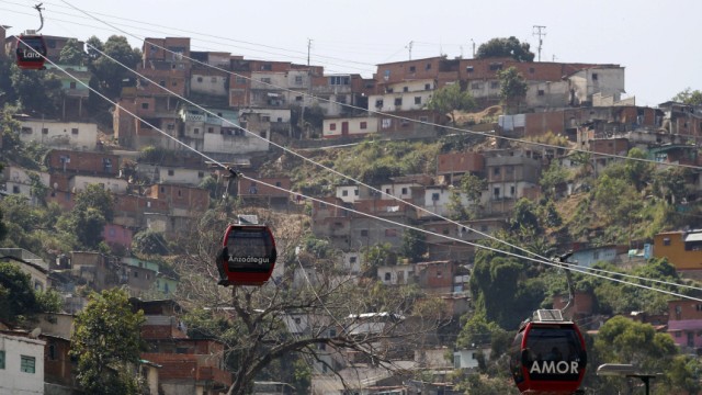 Metrocable cabins are seen as they travel in Caracas