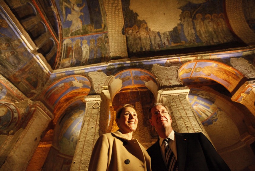 Germany's President Christian Wulff and his wife Bettina pose for the media inside the Goreme Museum in Turkeys central Anatolian province of Nevsehir
