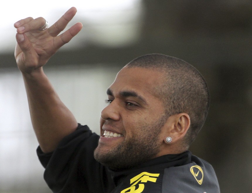 Brazilian soccer player Daniel Alves gestures after a media conference in Curitiba