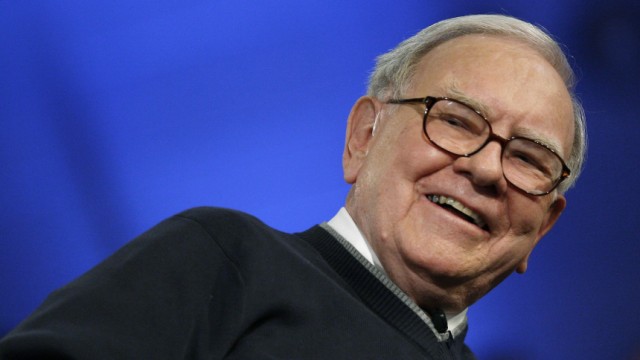 Warren Buffett laughs during appearance with Bill Gates for town hall style meeting with students at Columbia University in New York