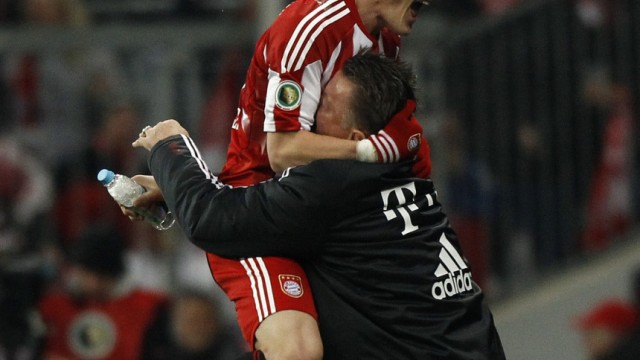 Bayern Munich's Schweinsteiger celebrates with coach van Gaal after scoring against Werder Bremen during German Soccer Cup (DFB-Pokal) match in Munich