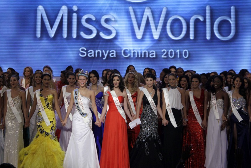 Miss USA and Miss World 2010 Alexandria Mills, first runner-up Miss Botswana Emma Wareus and runner-up Miss Venezuela Adriana Vasini celebrate at the end of the 60th Miss World pageant in Sanya