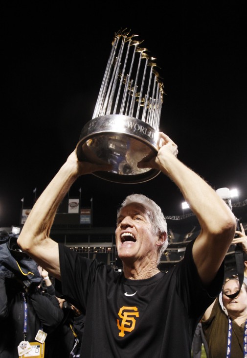 Giants owner Neukom holds Commissioner's Trophy after his team defeated the Rangers in Game 5 to win Major League Baseball's World Series in Arlington