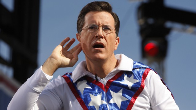 Comedian Stephen Colbert gestures during the 'Rally to Restore Sanity and/or Fear' on the National Mall in Washington