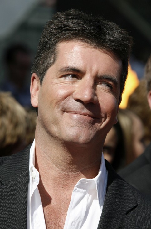 File photo of judge Simon Cowell poses as he arriving for the finale of  'American Idol' in Hollywood