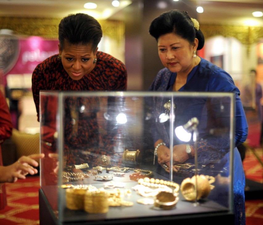U.S. first lady Obama tours an exhibition with her host Ani Yudhoyono, wife of Indonesia's President Susilo Bambang Yudhoyono, in Jakarta