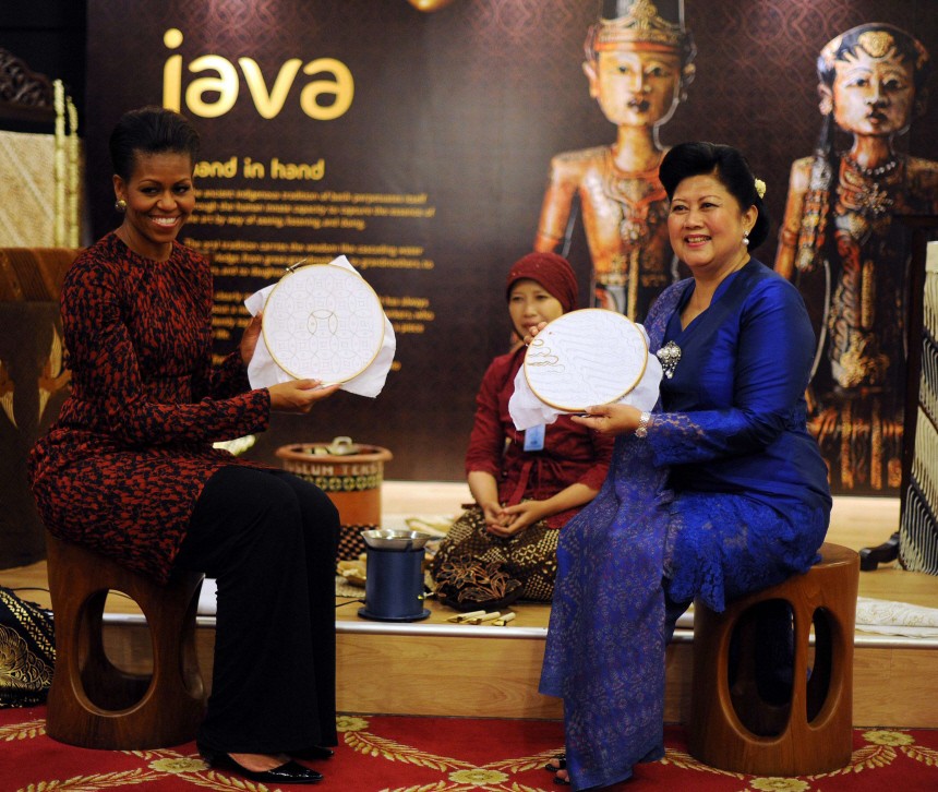 U.S. first lady Obama poses with Yudhoyono, wife of Indonesia's President Susilo Yudhoyono, in Jakarta