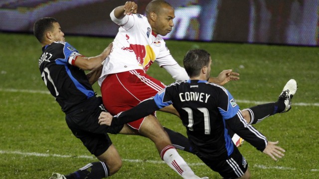 Red Bulls' Henry is tackled Earthquakes' Hernandez and Convey during their MLS Eastern Conference Semi Finals playoff match in Harrison