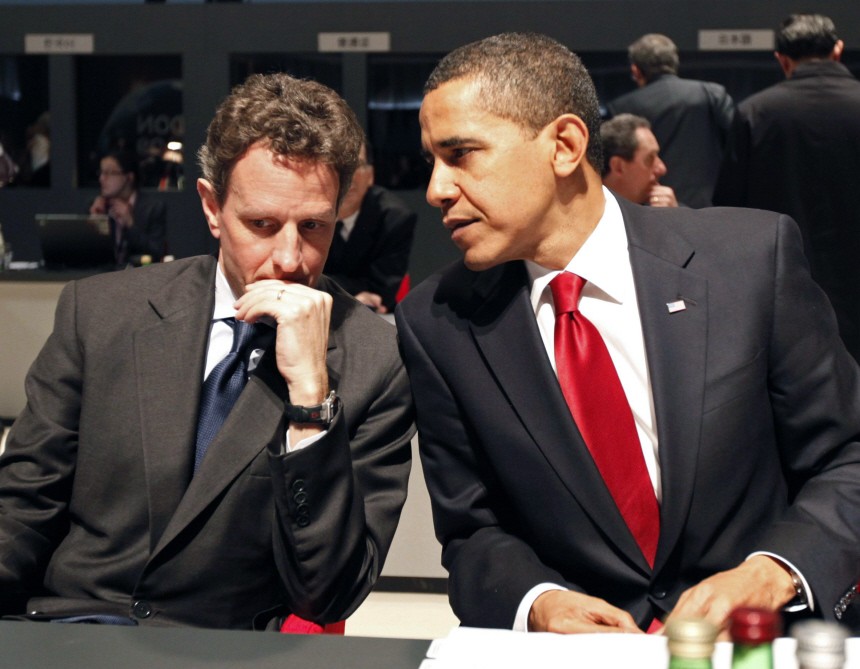 U.S President Obama speaks to Treasury Secretary Geithner before start of Plenary Session at G20 summit in east London