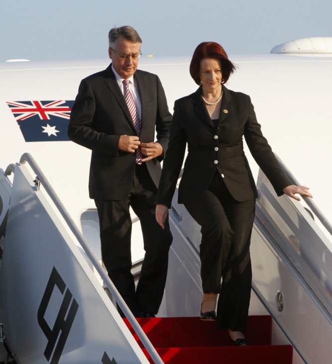 Australia's Prime Minister Julia Gillard and Treasurer Wayne Swan arrives at Seoul Airport in Seongnam