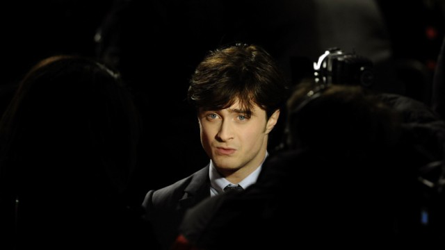 Britain's Radcliffe poses as he arrives for the world film premiere of 'Harry Potter and the Deathly Hallows: Part 1' in London