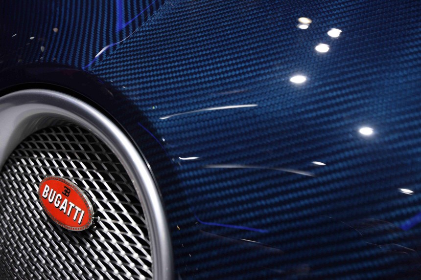 A Bugatti logo is seen on a Veyron car displayed on the exhibition stand of Bugatti during the first media day of the 80th Geneva Car Show