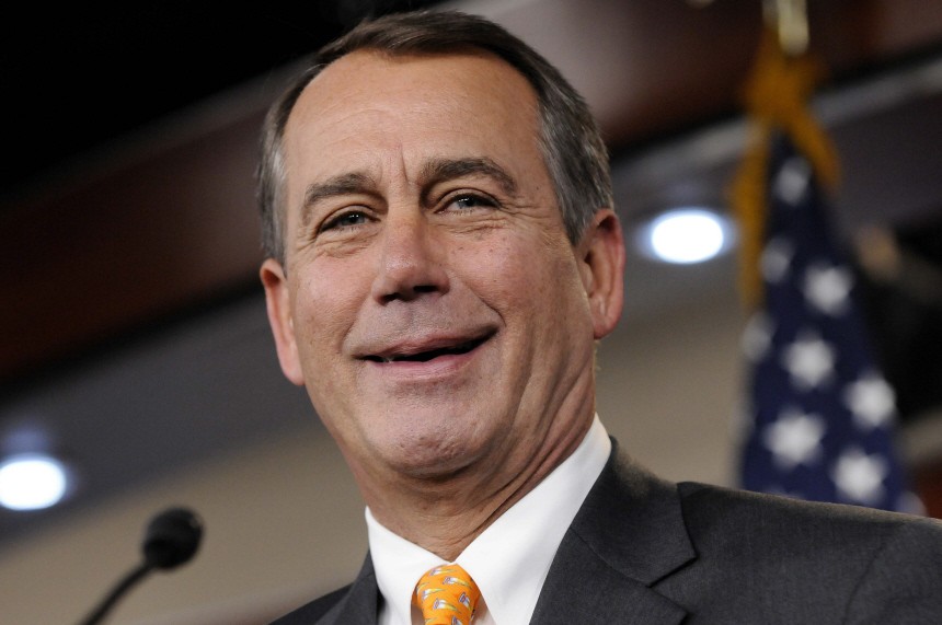 House Republican Leader John Boehner smiles during a news conference after sweeping Republican gains in midterm elections, in Washington