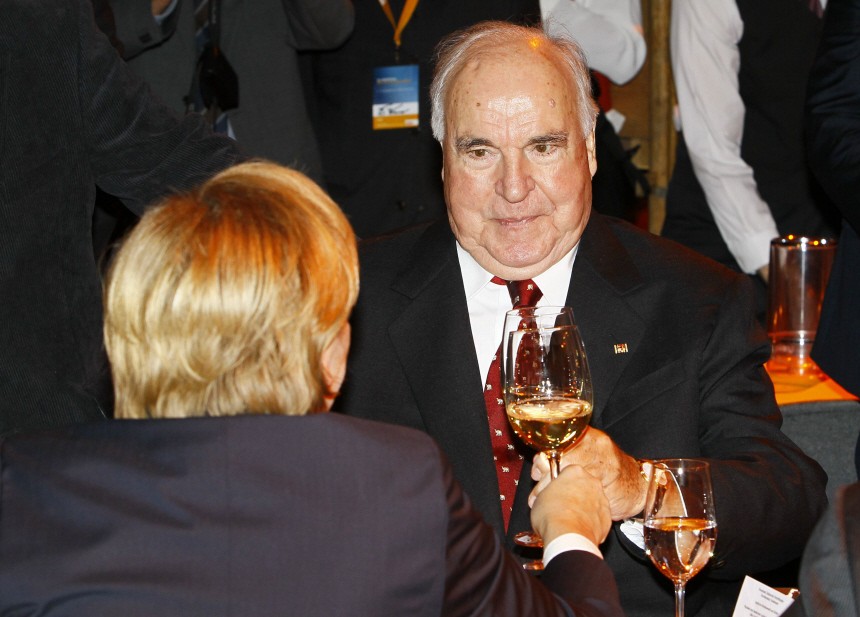 Former German Chancellor and CDU leader Kohl toasts with white wine to his successor Merkel in Karlsruhe