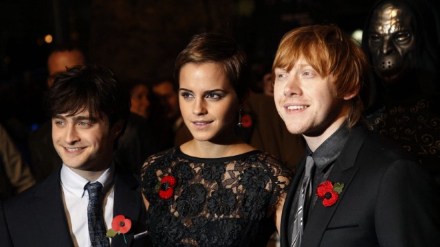 Britain's Watson with Radcliffe and Grint poses as they arrive for the world film premiere of 'Harry Potter and the Deathly Hallows: Part 1' in London