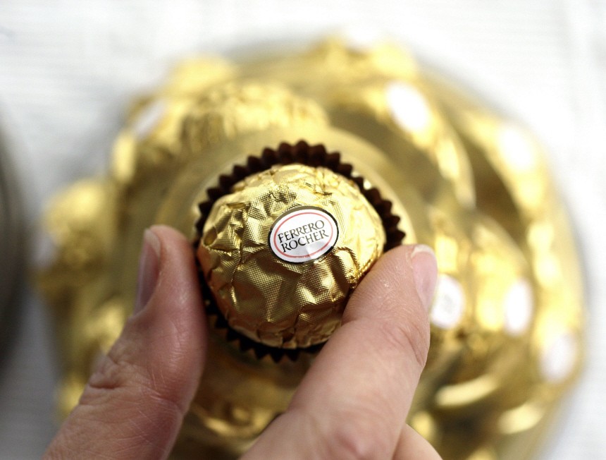 A woman takes a Ferrero Rocher chocolate in Milan