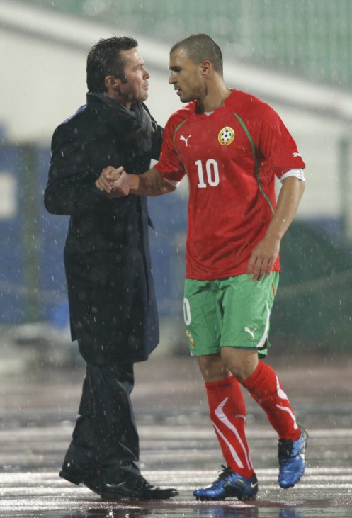 Bulgaria's Bozhinov shakes hands with head coach Matthaus as he leaves the pitch during international friendly soccer match against Serbia in Sofia