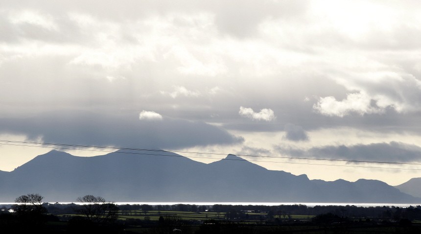 Part of the Snowdownia mountain range is seen above the Isle of Anglesey