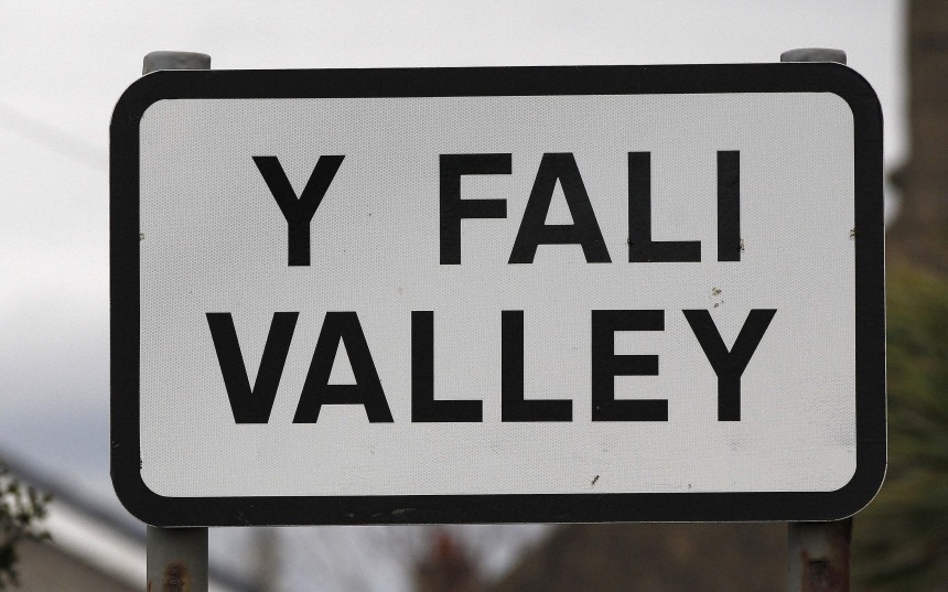 The village sign is seen at the entrance to Valley on Anglesey