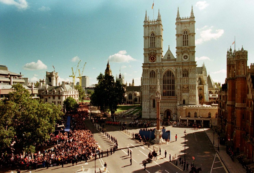 CROWDS AND THE CORTEGE OUTSIDE WESTMINSTER ABBEY IN LONDON