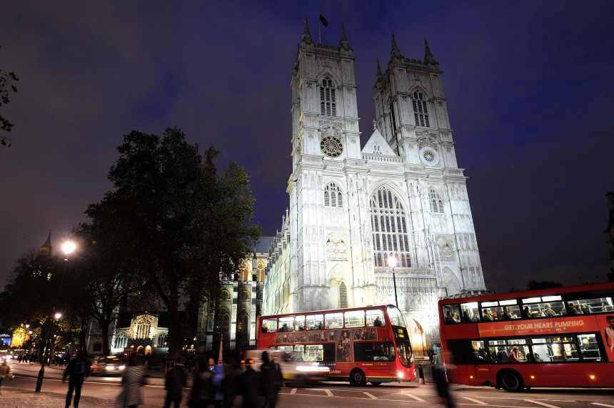 Westminster Abbey is lit up in the early evening, in central London