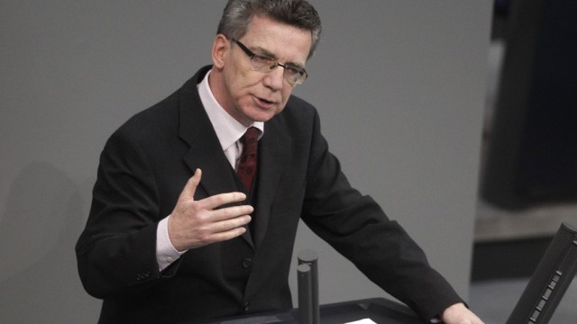 German Interior Minister de Maiziere delivers speech during Bundestag session in Berlin