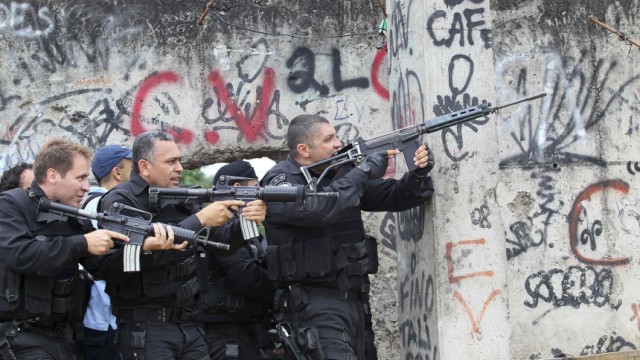 Policemen take position during operation at Jacarezinho slum  in Rio de Janeiro