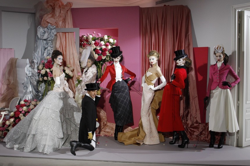 British designer Galliano appears with models at the end of his Haute-Couture Spring Summer 2010 fashion show for French fashion house Dior in Paris