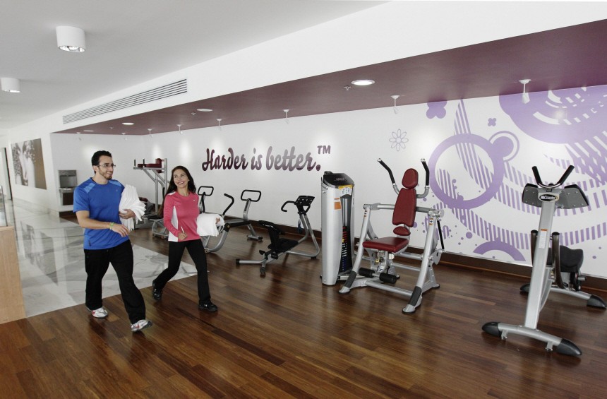 People walk in Hard Candy Fitness gym in Mexico City