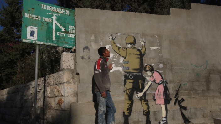 Banksy Graffiti Art On West Bank Barrier