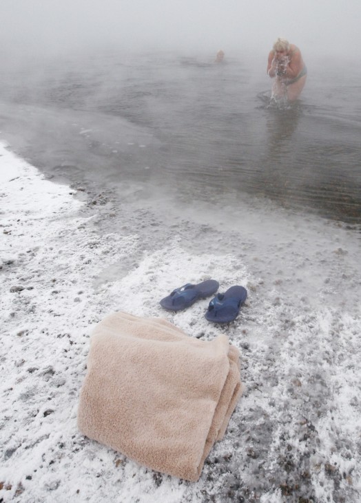 Members of a local winter swimmers' club bathe in the Yenisei River in Krasnoyarsk