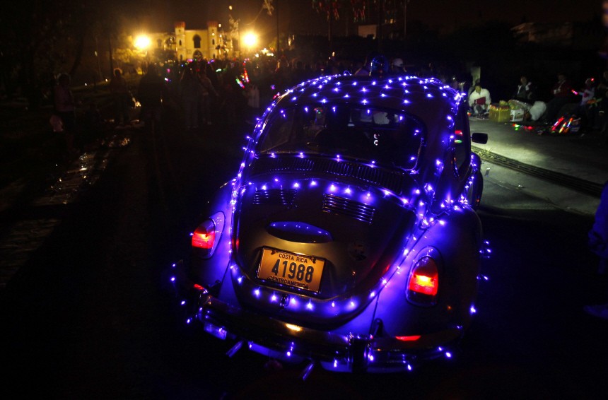 A car decorated with Christmas lights arrives at the illumination of the Children's Museum in San Jose