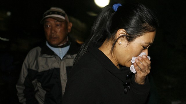 Sujata Shrestha, mother of air stewardess Sidikshha Gurung, mourns while inquiring at the head office of Yeti Airlines in Kathmandu