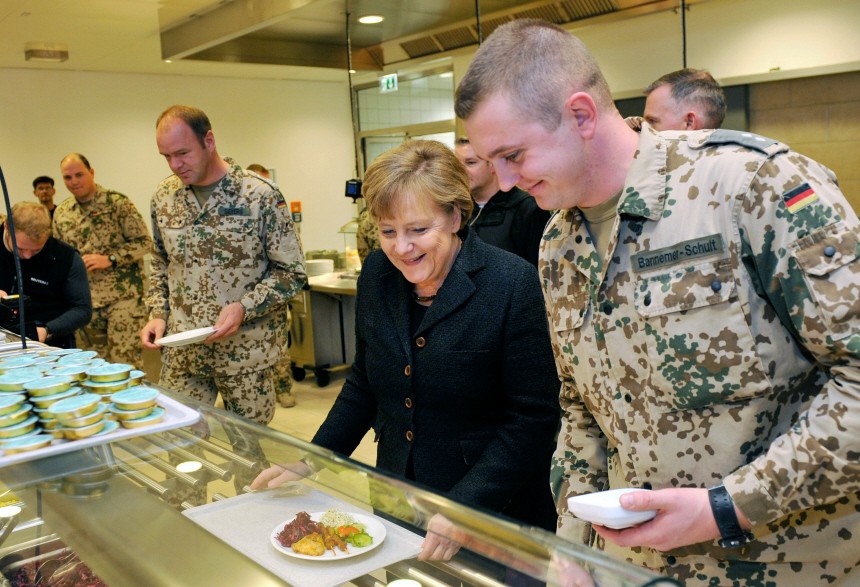 Chancellor Merkel Visits ISAF Soldier Camp In Kunduz