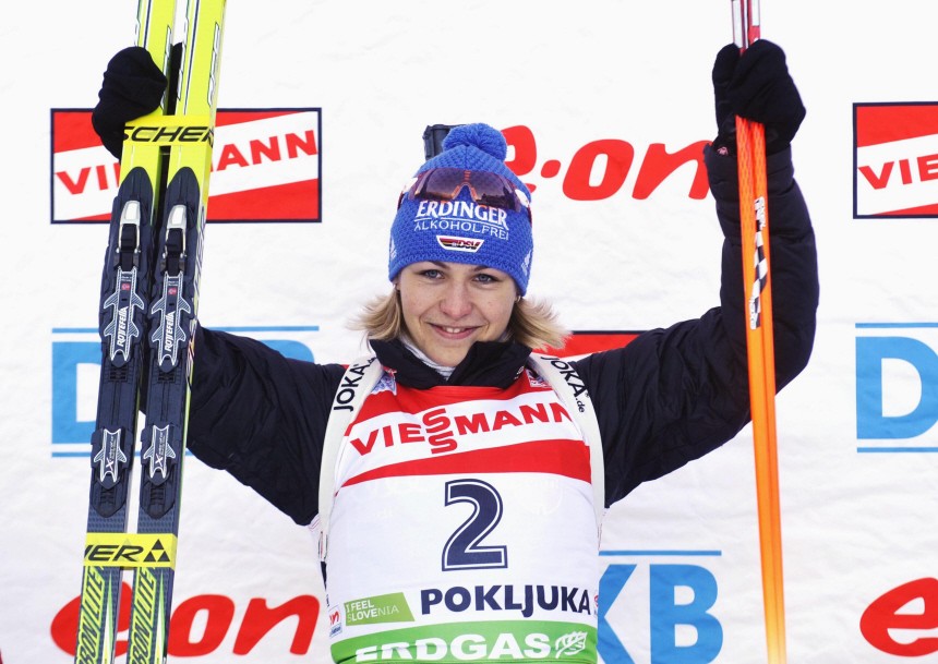 Neuner of Germany celebrates on the podium after winning the women's 7.5 km sprint biathlon World Cup event in Pokljuka