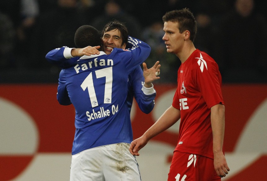 Schalke 04's Raul and Farfan celebrate a goal against Cologne during the German Bundesliga soccer match in Gelsenkirchen