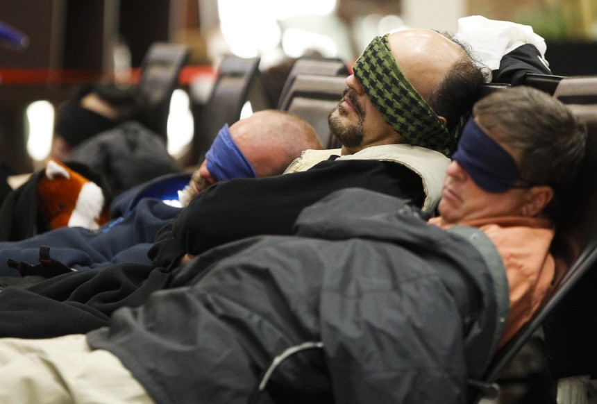 Traveller sleep at the main terminal of Frankfurt's airport