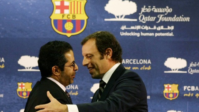 Barcelona's President Rosell embraces CEO of Qatar Sports Investment Ahmed Al-Sulaiti after signing a sponsorship contract with the Qatar Foundation in Barcelona